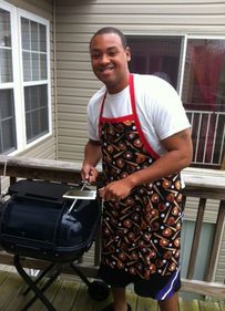 Man grilling with custom apron